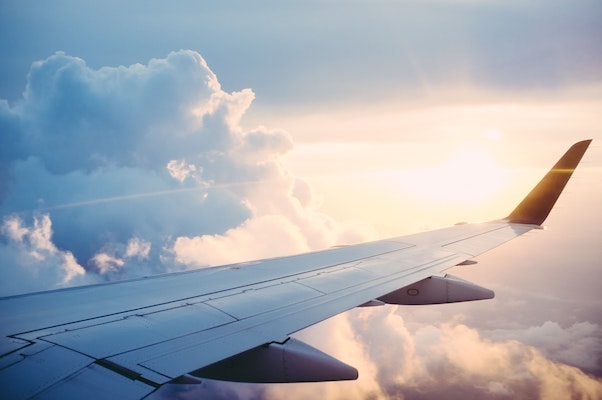 View of sun and clouds from an airplane passenger window